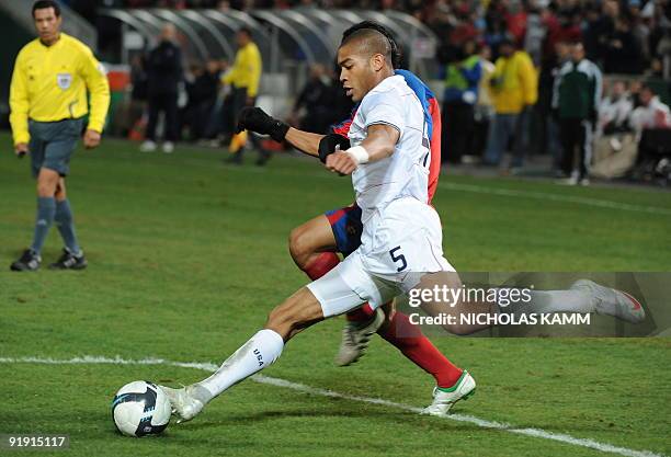 Defender Oguchi Onyewu clears the ball in front of Costa Rican midfielder Esteban Sirias during a 2010 World Cup qualifier at RFK Stadium in...