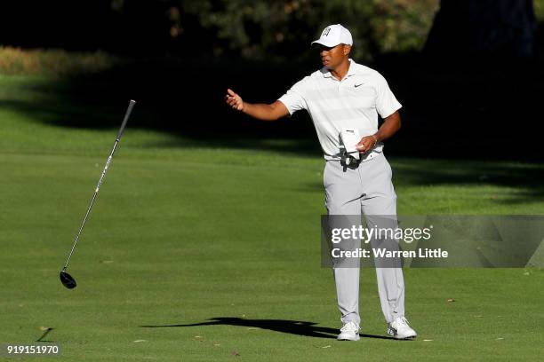 Tiger Woods tosses his club after his shot on the 13th hole during the second round of the Genesis Open at Riviera Country Club on February 16, 2018...