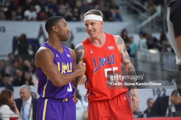 Michael B. Jordan and Jason Williams shake hands during the 2018 NBA All-Star Game Celebrity Game at Los Angeles Convention Center on February 16,...