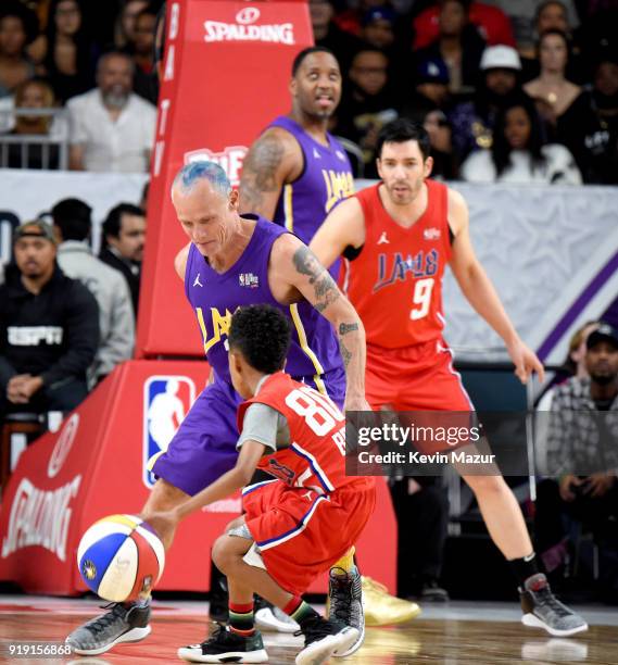 Musician Flea, Miles Brown, and Drew Scott play during the NBA All-Star Celebrity Game 2018 presented by Ruffles at Verizon Up Arena at LACC on...