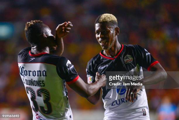 Julian Quiñones of Lobos BUAP celebrates with teammates after scoring opening goal, during the 8th round match between Monarcas and Lobos BUAP as...