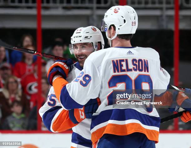Brock Nelson of the New York Islanders celebrates a second period goal scored by Johnny Boychuk against the Carolina Hurricanes of the New York...