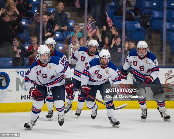 Oliver Wahlstrom of the USA Nationals celebrates a third period, game tying goal with teammates Jack Hughes, Adam Samuelsson, Joel Farabee and...