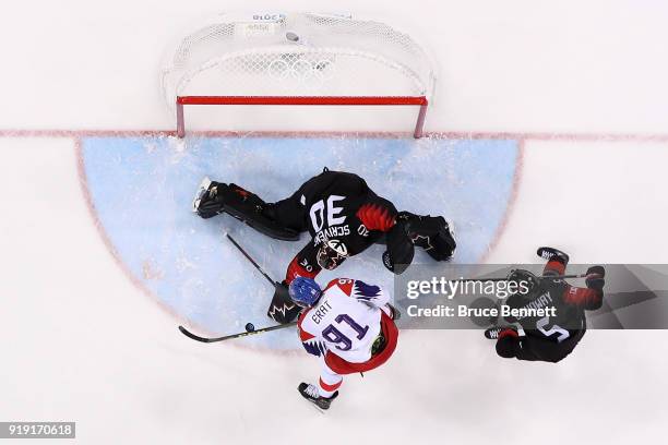 Martin Erat of the Czech Republic attempts a shot on Ben Scrivens of Canada during the Men's Ice Hockey Preliminary Round Group A game on day eight...