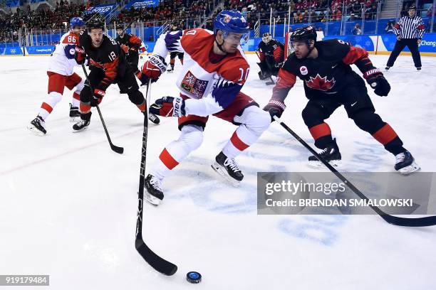 Canada's Marc-Andre Gragnani , Czech Republic's Roman Cervenka , and Canada's Derek Roy chases the puck during the first period of a men's...