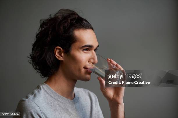 Young man drinking glass of water