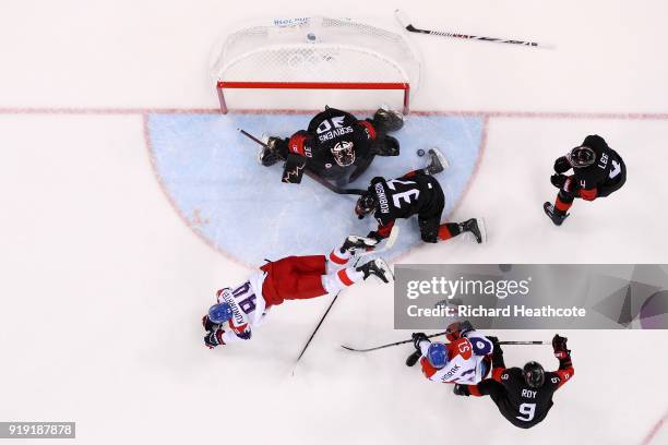 Tomas Kundratek of the Czech Republic collides with Mat Robinson of Canada in the second period during the Men's Ice Hockey Preliminary Round Group A...