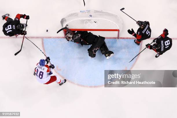 Ben Scrivens of Canada makes a save against Czech Republic in the second period during the Men's Ice Hockey Preliminary Round Group A game on day...