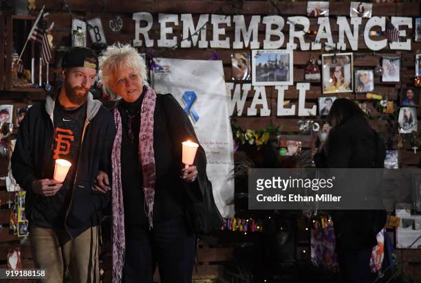 Taylor Carrington and Maggie Carrington, both of Nevada, hold candles during a vigil put together by the Route 91 Foundation at the Las Vegas...