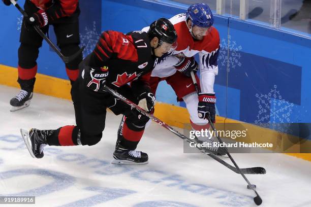 Jiri Sekac of the Czech Republic skates against Rene Bourque of Canada in the third period during the Men's Ice Hockey Preliminary Round Group A game...
