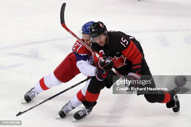 Brandon Kozun of Canada collides with Martin Muzicka of Czech Republic in the third period during the Men's Ice Hockey Preliminary Round Group A game...