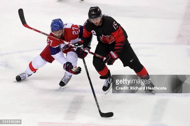 Brandon Kozun of Canada collides with Martin Muzicka of Czech Republic in the third period during the Men's Ice Hockey Preliminary Round Group A game...