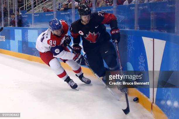 Cody Goloubef of Canada controls the puck against Tomas Kundratek of the Czech Republic during the Men's Ice Hockey Preliminary Round Group A game on...