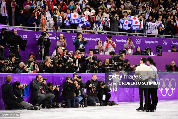 Third-placed Spain's Javier Fernandez , winner Japan's Yuzuru Hanyu and second-placed Japan's Shoma Uno pose for photographers during the venue...