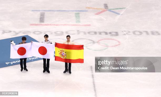 Silver medal winner Shoma Uno of Japan, gold medal winner Yuzuru Hanyu of Japan and bronze medal winner Javier Fernandez of Spain celebrate during...