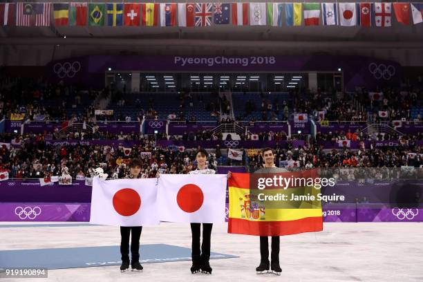 Silver medal winner Shoma Uno of Japan, gold medal winner Yuzuru Hanyu of Japan and bronze medal winner Javier Fernandez of Spain celebrate during...