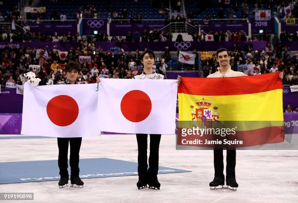 Silver medal winner Shoma Uno of Japan, gold medal winner Yuzuru Hanyu of Japan and bronze medal winner Javier Fernandez of Spain celebrate during...