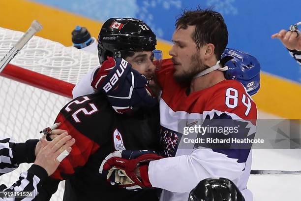 Eric O'Dell of Canada and Tomas Kundratek of the Czech Republic exchange words in overtime during the Men's Ice Hockey Preliminary Round Group A game...