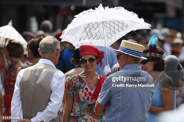People in period costume enjoy the atmosphere in Emerson Street during the Art Deco Festival on February 17, 2018 in Napier, New Zealand. The annual...