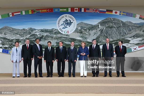 The members of the G8 pose for a family photo, left to right, Taro Aso, Japan's prime minister, Stephen Harper, Canada's prime minister, U.S....