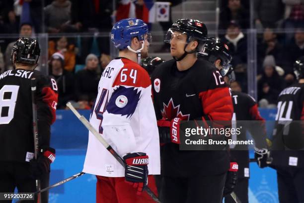 Jiri Sekac of the Czech Republic and Rob Klinkhammer of Canada talk following the Men's Ice Hockey Preliminary Round Group A game on day eight of the...