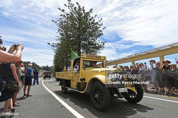 Crowds watch a parade of vintage cars during the Art Deco Festival on February 17, 2018 in Napier, New Zealand. The annual five day festival...