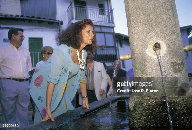 Carmen Alborch in Guisando The minister of Culture drinking water from a fountain
