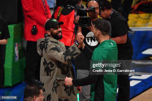 Kyrie Irving of the Boston Celtics greets Jayson Tatum of the USA Team during the Mountain Dew Kickstart Rising Stars Game during All-Star Friday...