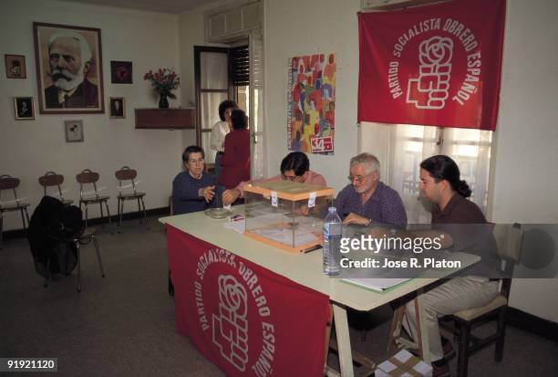 Electoral table in the primary elections of the PSOE A group of people is gathered next to an electoral table during the primary elections of the...
