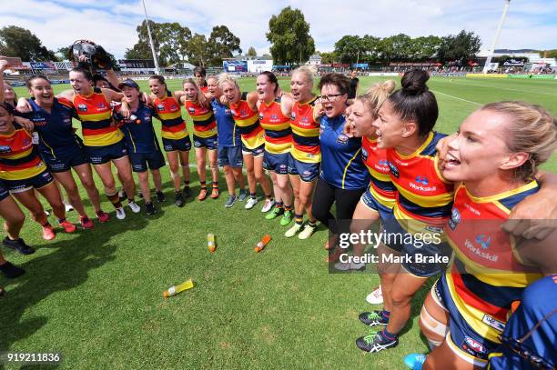 Adelaide Crows girls sing the club song after their win during the round three AFLW match between the Adelaide Crows and the Western Bulldogs at...