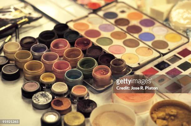 Make-up. Detail of make-up, paintings and eye-shadows on the table of a dressing room of the Cibeles Gangplank of Madrid.