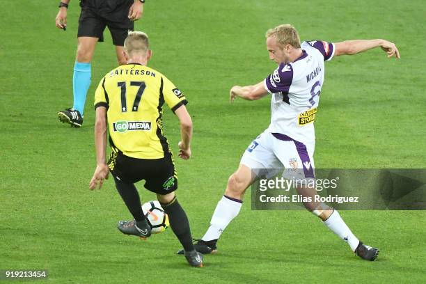 Monty Patterson of Wellington Phoenix and Mitch Nichols of Perth Glory contest ball during the round 20 A-League match between the Wellington Phoenix...