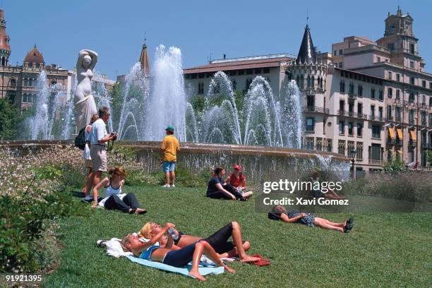 People taking the sun in the Seat from Catalonia, Barcelona