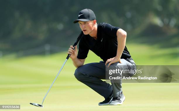 Markus Kinhult of Sweden lines up his putt on the first green during the third round of the NBO Oman Open at Al Mouj Golf on February 17, 2018 in...
