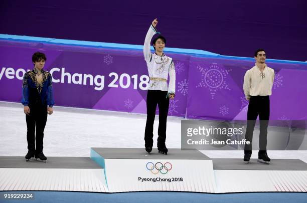 Silver medalist Shoma Uno of Japan, gold medalist Yuzuru Hanyu of Japan, bronze medalist Javier Fernandez of Spain during the victory ceremony...