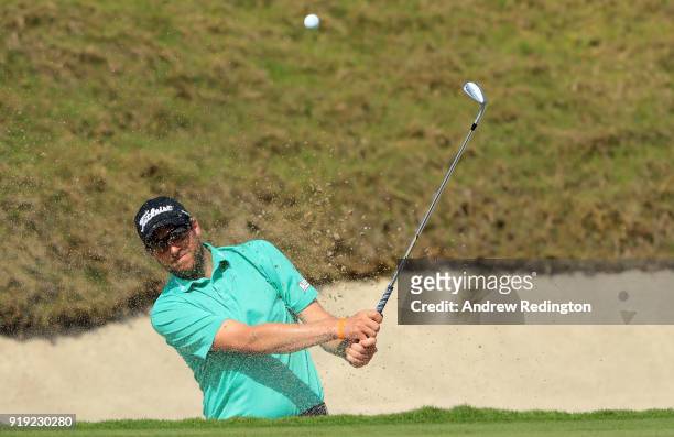 Matthew Southgate of England plays his fifth shot on the par five 7th hole during the third round of the NBO Oman Open at Al Mouj Golf on February...
