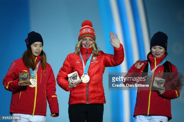 Silver medalist Xin Zhang of China, gold medalist Hanna Huskova of Belarus and bronze medalist Fanyu Kong of China celebrate during the medal...