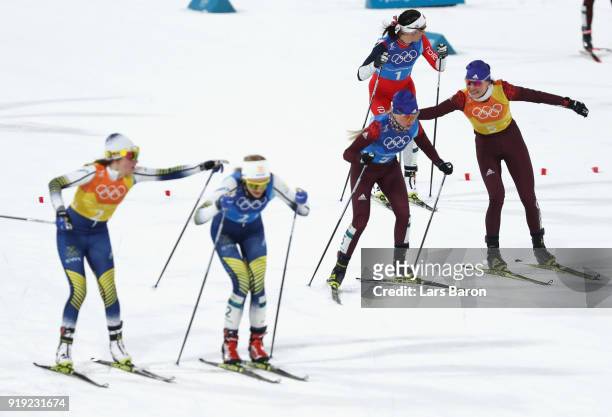 Anastasia Sedova of Olympic Athlete from Russia hands over to Anna Nechaevskaya of Olympic Athlete from Russia during the Ladies' 4x5km Relay on day...