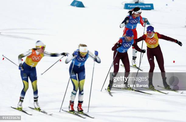 Anastasia Sedova of Olympic Athlete from Russia hands over to Anna Nechaevskaya of Olympic Athlete from Russia during the Ladies' 4x5km Relay on day...