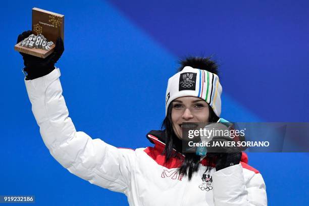 Austria's silver medallist Anna Fenninger Veith poses on the podium during the medal ceremony for the alpine skiing women's Super-G at the...