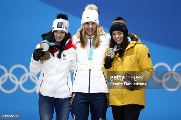 Silver medalist Anna Veith of Austria, gold medalist Ester Ledecka of Czech Republic and bronze medalist Tina Weirather of Liechtenstein celebrate...