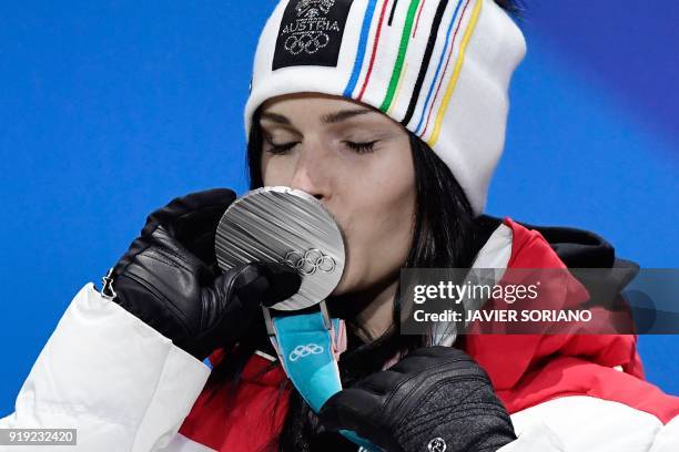 Austria's silver medallist Anna Fenninger Veith kisses her medal on the podium during the medal ceremony for the alpine skiing women's Super-G at the...