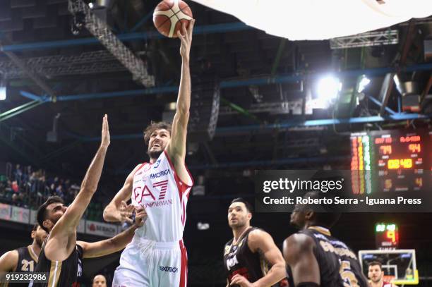 Davide Pascolo of Armani competes with Salvatore Parrillo and Christian Burns and David Cournooh of MIA during the LBA Legabasket of serie A match...