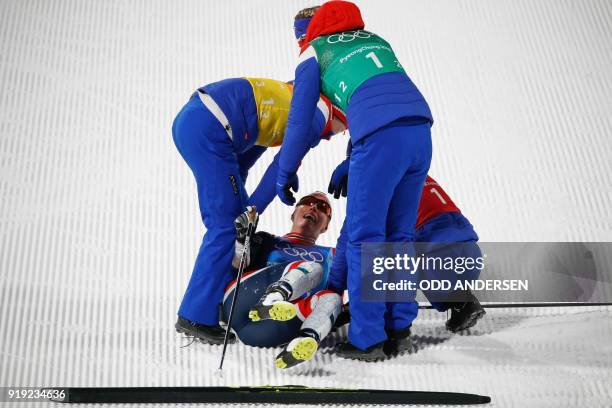 Norway's team celebrate winning the women's 4x5km classic free style cross country relay at the Alpensia cross country ski centre during the...