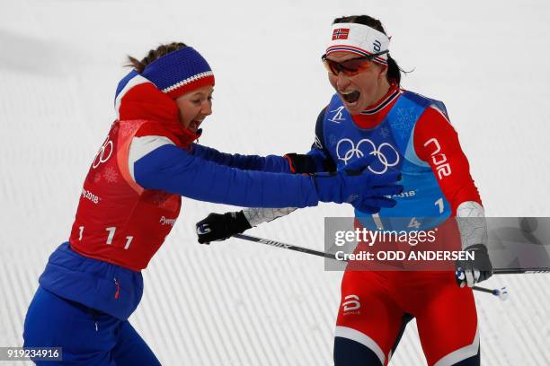 Norway's Marit Bjorgen and Norway's Ingvild Flugstad Oestberg celebrate wining the women's 4x5km classic free style cross country relay at the...