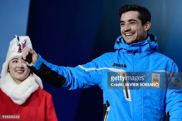 Spain's bronze medallist Javier Fernandez waves on the podium during the medal ceremony for the figure skating Men's singles event at the Pyeongchang...