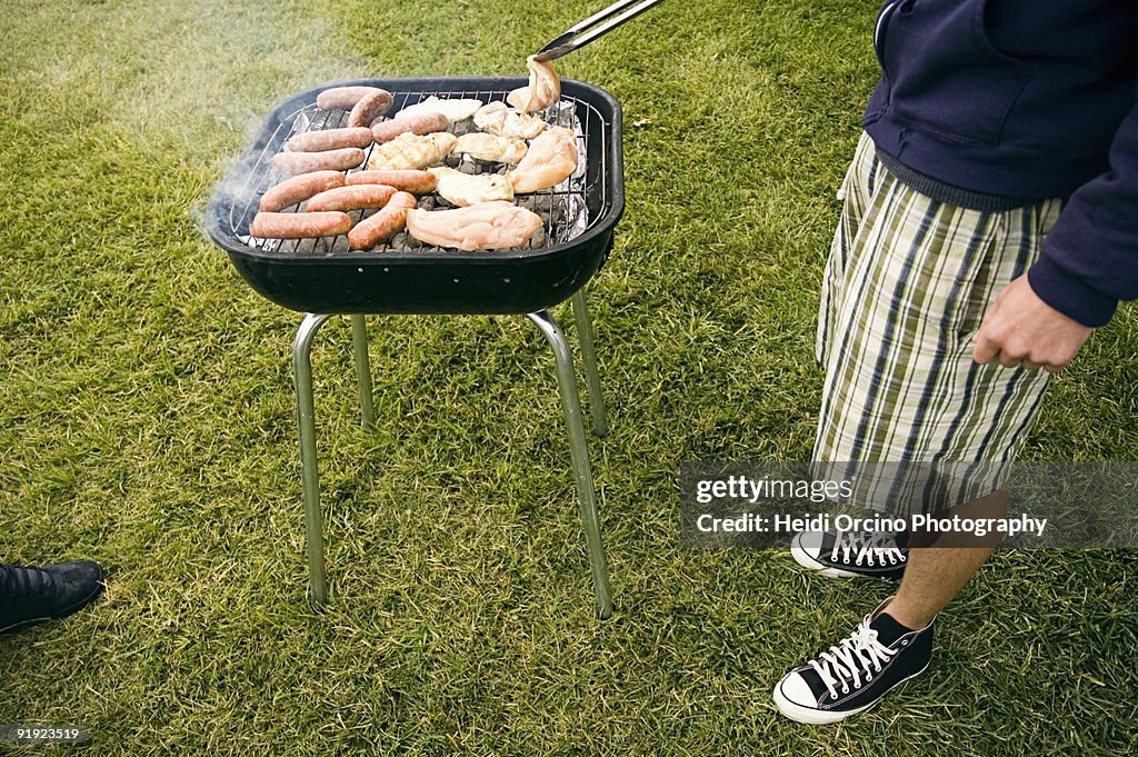 Man barbecuing on grill