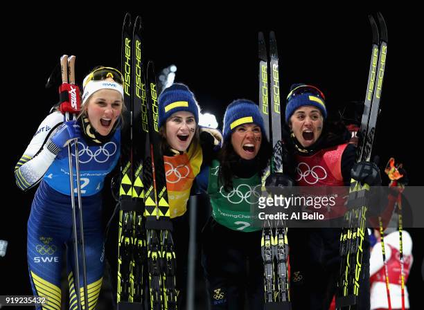 Silver medalists Stina Nilsson, Ebba Andersson, Charlotte Kalla and Anna Haag of Sweden celebrate after the Ladies' 4x5km Relay on day eight of the...