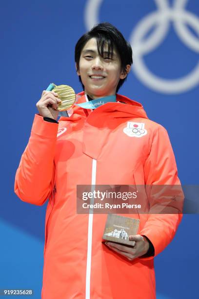 Gold medalist Yuzuru Hanyu of Japan celebrates during the medal ceremony for the Men's Figure Skating - Single Free Skating on day eight of the...