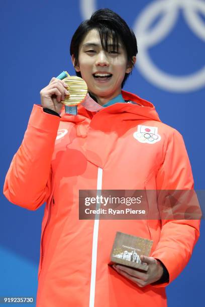 Gold medalist Yuzuru Hanyu of Japan celebrates during the medal ceremony for the Men's Figure Skating - Single Free Skating on day eight of the...